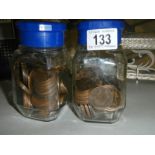 Two jars of copper pennies.