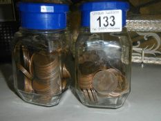 Two jars of copper pennies.