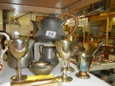 A pewter tea set and other metal ware.