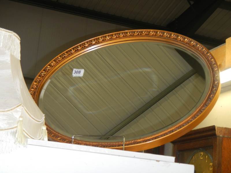 An oval bevel edged mirror, COLLECT ONLY. - Image 2 of 2
