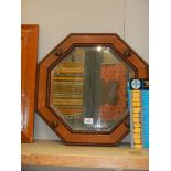 An oak framed octagonal bevel edged mirror, COLLECT ONLY.