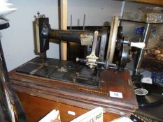 A vintage wood cased sewing machine. COLLECT ONLY.