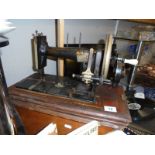 A vintage wood cased sewing machine. COLLECT ONLY.