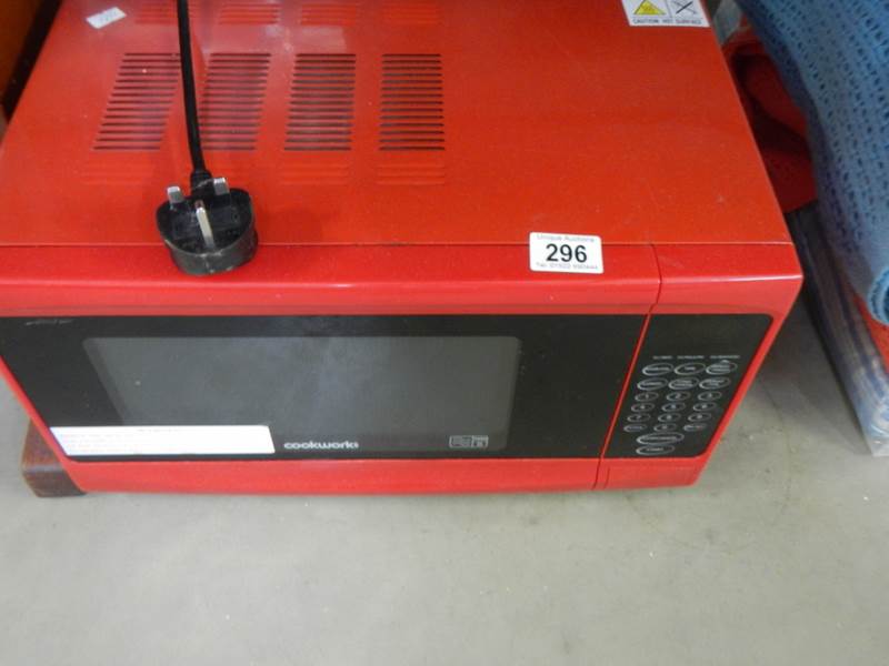 A red Cookworks microwave oven. COLLECT ONLY.