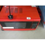 A red Cookworks microwave oven. COLLECT ONLY.