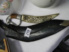 A kukri and one other knife.