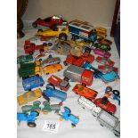 A mixed lot of play-worn die cast vehicles.