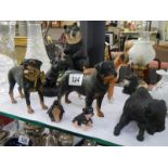 A quantity of Rotwieler figure, boxer dog, bear etc.,