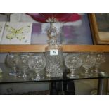 A cut glass decanter and six cut glass brandy goblets, COLLECT ONLY.