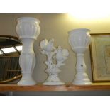 Two white pottery jardiniere's on stands and a dove figure, COLLECT ONLY.