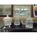 Two cut glass vases, a cut glass biscuit jar and a moulded glass sugar bowl with lid, COLLECT ONLY.