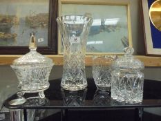 Two cut glass vases, a cut glass biscuit jar and a moulded glass sugar bowl with lid, COLLECT ONLY.