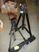 Two camera tripods.