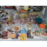 A mixed lot of pub glasses and beer mats,. COLLECT ONLY.