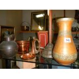 A mixed lot of brass and copper including jug, vase etc.,