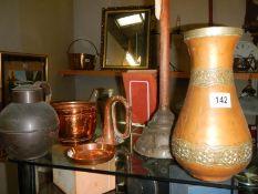 A mixed lot of brass and copper including jug, vase etc.,