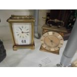 A brass carriage clock and one other.