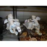 A pair of porcelain cherub wall pockets.