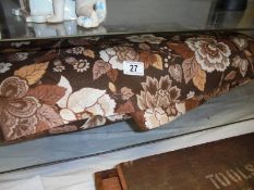 A large roll of 1970's curtain fabric.