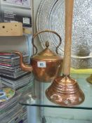 A Victorian copper kettle and a copper washing posher.