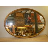 An oval bevel edged mirror, COLLECT ONLY.