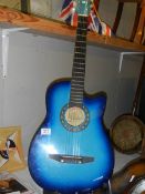 A blue acoustic guitar, COLLECT ONLY.