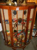 A bow front china cabinet, COLLECT ONLY.