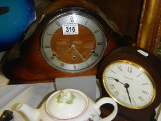 Two mantel clocks.