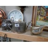 A silver plate teapot, sugar bowl and gravy boat.