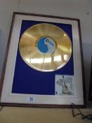 A framed Hank Williams greatest hits gold disc (missing glass) COLLECT ONLY.