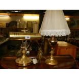 A brass desk lamp and one other.