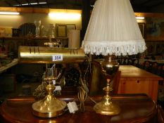 A brass desk lamp and one other.