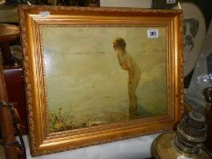 A gilt framed study of a nude lady standing in a pool, COLLECT ONLY.