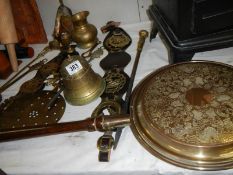 A mixed lot of brass ware including bell, warming pan etc., COLLECT ONLY.