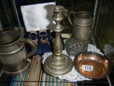 A mixed lot including napkin rings, tankards, candlestick etc.,