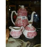 A three piece ceramic tea set.