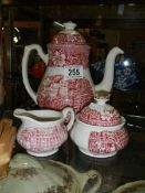 A three piece ceramic tea set.