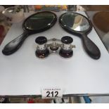 A pair of opera glasses, and two hand mirrors.