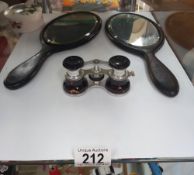 A pair of opera glasses, and two hand mirrors.