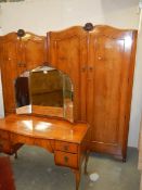 A mahogany bedroom suite comprising triple mirror dressing table and two wardrobes, COLLECT ONLY.