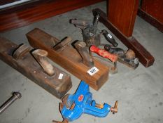 A mixed lot of old tools including planes.
