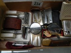 A mixed lot of razors, lighters etc.,