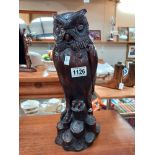 A heavy resin figure of an owl in a wood effect finish COLLECT ONLY