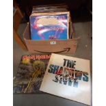 A box of vinyl records including The Shadows, country and western etc