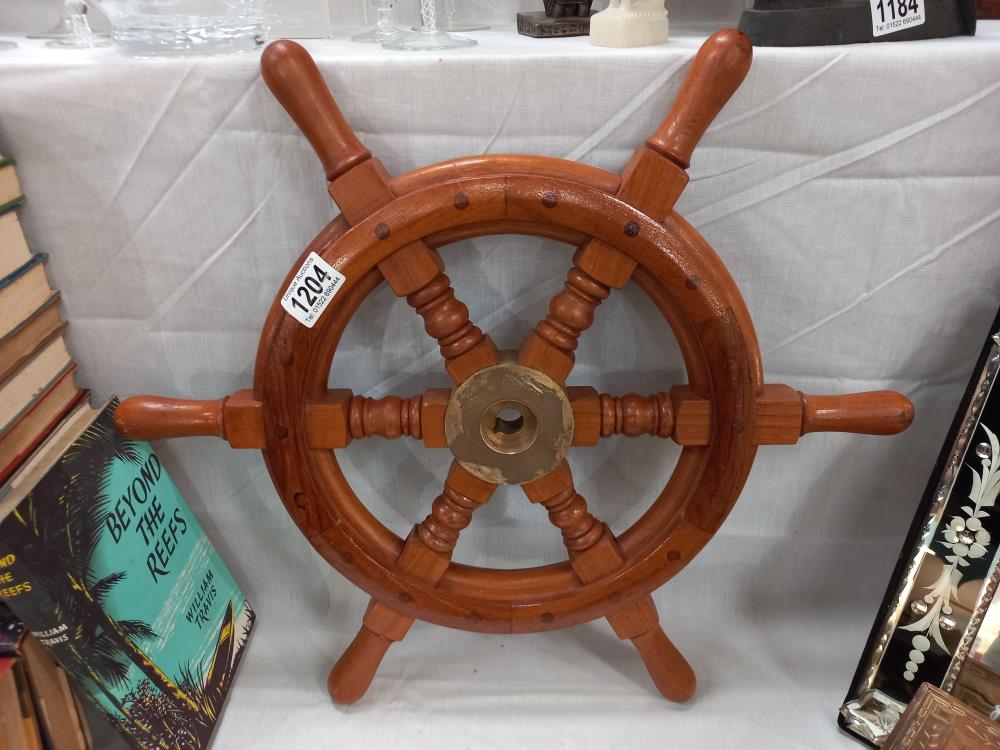 A wooden ships wheel with brass hub COLLECT ONLY