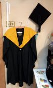 A boxed mortar board & Graduation gown