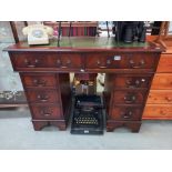 A dark stained double pedestal desk with gilded green leather top COLLECT ONLY