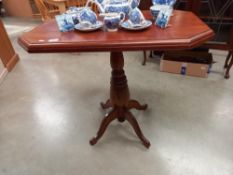 A mahogany tea table on centre column base COLLECT ONLY.