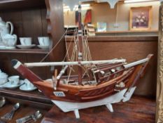 A wooden model of a boat COLLECT ONLY.