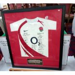 A framed & glazed signed England rugby shirt, 2002 including Wilkinson etc. (approximately 29